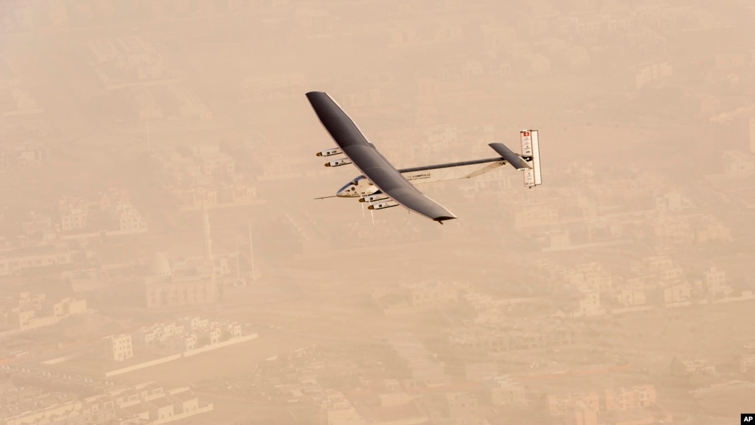 In this photo released by Solar Impulse, "Solar Impulse 2", a solar-powered airplane flies after taking off from Al Bateen Executive Airport in Abu Dhabi, United Arab Emirates, March 9, 2015.