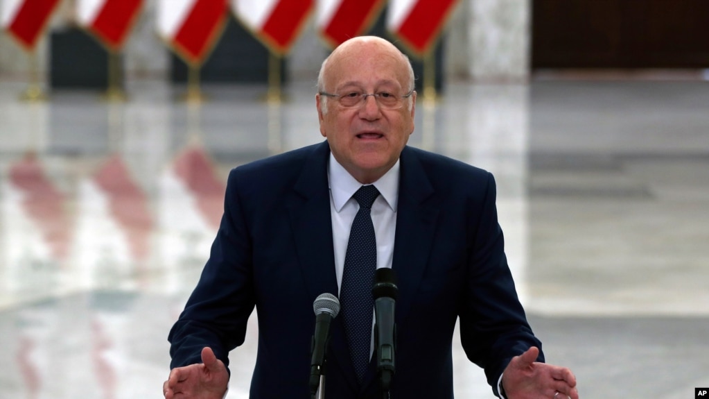 Lebanese Prime Minister-designate Najib Mikati, speaks to journalists after his meeting with Lebanese President Michel Aoun, at the Presidential Palace in Baabda, east of Beirut, Lebanon, July 26, 2021.