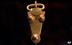 A golden belt buckle uncovered at an Anglo-Saxon burial site in the village of Prittlewell in 2003 on display at Southend Central Museum in Southend, England, May 8, 2019.