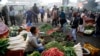 Indians buy vegetables early morning at a whole sale market in Lucknow, India , Jan. 27, 2020. Rising food and vegetable prices have taken retail inflation for the month of December to its highest level in over 5 years, according to news reports. 