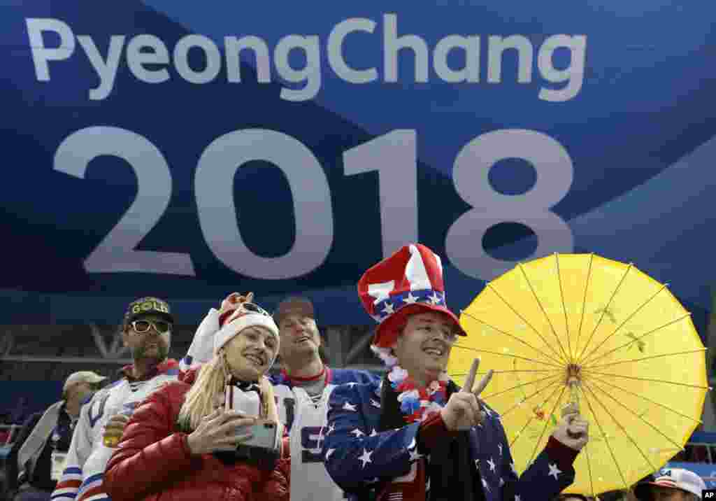 Fans cheer during the third period of the women's gold medal hockey game between the United States and Canada at the 2018 Winter Olympics in Gangneung, South Korea, Feb. 22, 2018.