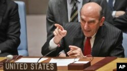 FILE - U.S. Special Representative for Venezuela Elliott Abrams points towards Russia's United Nations Ambassador during a tense exchange at a meeting on Venezuela in the U.N. Security Council at U.N. headquarters, Feb. 26, 2019. 