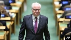 FILE - Russian Ambassador to the United Nations Vitaly Churkin returns to his seat at United Nations headquarters, Oct. 13, 2016. Russia failed to win re-election to the U.N. Human Rights Council on Friday. "It was a very close vote," Churkin said.