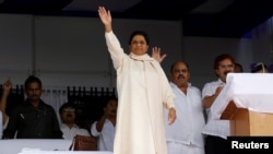 FILE - The Bahujan Samaj Party (BSP) chief Mayawati waves to her supporters during an election campaign rally on the occasion of the death anniversary of Kanshi Ram, founder of BSP, in Lucknow, India, Oct. 9, 2016.
