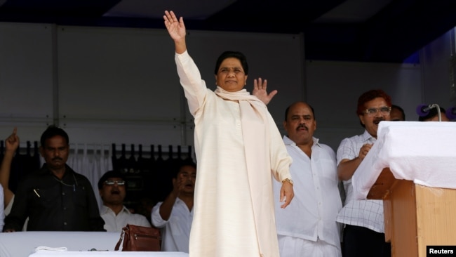 FILE - The Bahujan Samaj Party (BSP) chief Mayawati waves to her supporters during an election campaign rally on the occasion of the death anniversary of Kanshi Ram, founder of BSP, in Lucknow, India, Oct. 9, 2016.