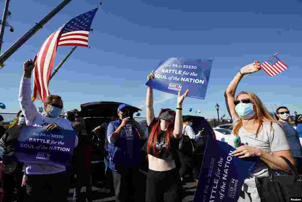 Supporters of Democratic U.S. presidential nominee Joe Biden celebrate near the site of his planned election victory celebration in Wilmington, Delaware.