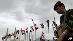A Yemeni soldier stands guard during a rally in support of Yemen's President Ali Abdullah Saleh in Sana'a, May 6, 2011.