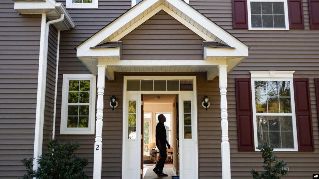 FILE - In this July 21, 2020, file photo, a homeowner tours their new home, in Washingtonville, N.Y. Limited housing supply has led to more millennials renting for a longer period of time. (AP Photo/John Minchillo, File)