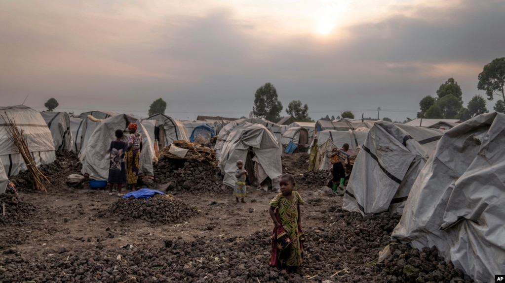 People displaced by the ongoing fighting gather at refugee camp on the outskirts of Goma Democratic Republic of Congo on July 11 2024