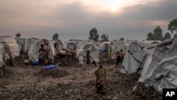 People displaced by ongoing fighting gather at a refugee camp on the outskirts of Goma, Democratic Republic of the Congo, on July 11, 2024.