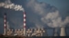 FILE PHOTO: Smoke and steam billow from Belchatow Power Station, Europe's largest coal-fired power plant powered by lignite, operated by Polish utility PGE, in Kamiensk