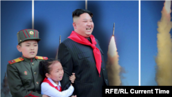 North Korea leader with rockets and kids