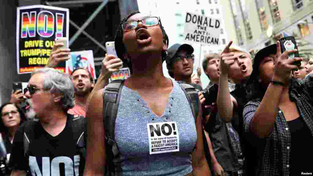 Anti-racism protesters shout during protests against President Trump.