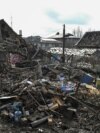 Rescuers work at the site of residential buildings damaged during a Russian drone strike, amid Russia's attack on Ukraine, in Zaporizhzhia, Ukraine March 28, 2024.