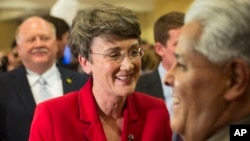 FILE - Heather Wilson visits with supporters, Nov. 6, 2012, at a Republican election party in Albuquerque, New Mexico.