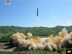 This image made from video of a news bulletin aired by North Korea's KRT on Tuesday, July 4, 2017, shows what was said to be the launch of a Hwasong-14 intercontinental ballistic missile, ICBM, in North Korea's northwest.