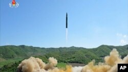 This image made from video of a news bulletin aired by North Korea's KRT on Tuesday, July 4, 2017, shows what was said to be the launch of a Hwasong-14 intercontinental ballistic missile, ICBM, in North Korea's northwest. 