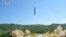 This image made from video of a news bulletin aired by North Korea's KRT on Tuesday, July 4, 2017, shows what was said to be the launch of a Hwasong-14 intercontinental ballistic missile, ICBM, in North Korea's northwest. 