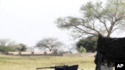 An armored vehicle is parked in front of the joint task force headquarters in Maiduguri, Nigeria. (File Photo - September 26, 2011)