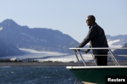 FILE - U.S. President Barack Obama views Bear Glacier on a boat tour of Kenai Fjords National Park in Seward, Alaska, Sept. 1, 2015. Reining in global warming is key, said speakers Thursday at the World Climate Summit in Washington.