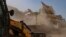 FILE - Authorities demolish the residence of an activist in Prayagraj, India, June 12, 2022. 