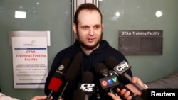 Joshua Boyle speaks to reporters after arriving with his wife and three children at Toronto Pearson International Airport, nearly five years after he and his wife were abducted in Afghanistan in 2012 by the Taliban-allied Haqqani network, in Toronto, Ontario, Oct. 13, 2017.