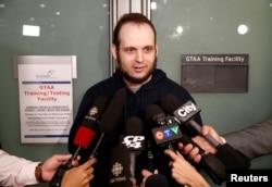 Joshua Boyle speaks to reporters after arriving with his wife and three children at Toronto Pearson International Airport, nearly five years after he and his wife were abducted in Afghanistan in 2012 by the Taliban-allied Haqqani network, in Toronto, Onta