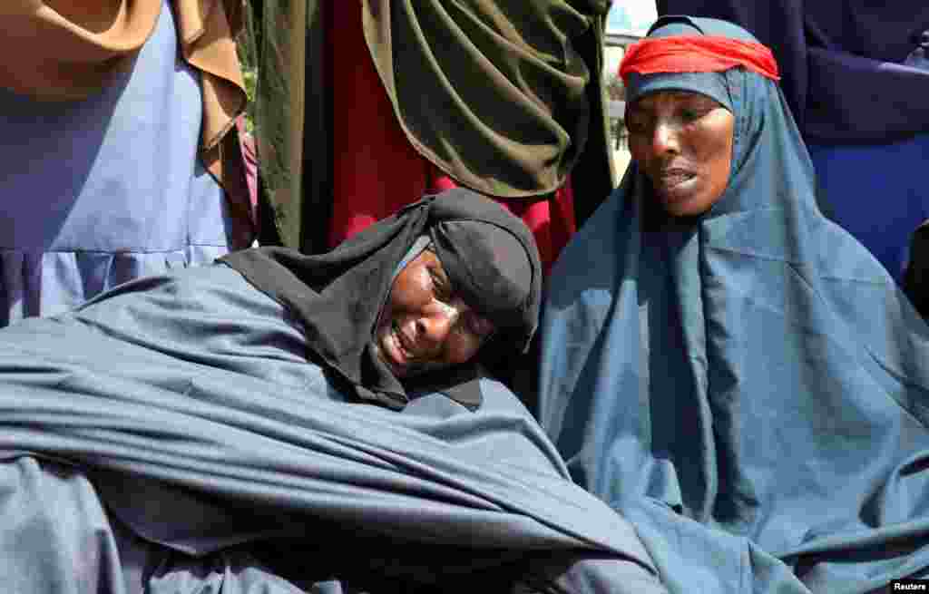 Somali women who say their sons have been used as fighters in the Tigray conflict in neighboring Ethiopia, react during a protest in Mogadishu, Somalia.