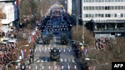 Bosnian Serb police officers take part in a parade marking the "Day of Republic Srpska" in Banja Luka, Jan. 9, 2019, defying a 2016 legal ban.