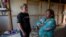 FILE - Francisca Ramirez, right, talks with Deputy High Commissioner for the U.N. Refugee Agency, Kelly Clements, in a community of Nicaraguan refugees, in Upala, Costa Rica, Feb. 8, 2020.
