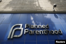 FILE - A sign is pictured at the entrance to a Planned Parenthood building in New York.