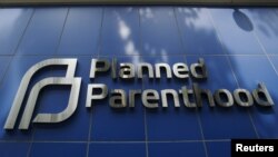 FILE - A sign is pictured at the entrance to a Planned Parenthood building in New York.