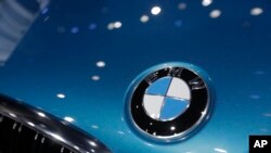 Perusahaan pabrik mobil Jerman BMW mengatakan perusahaan itu menentang rencana koalisi Kanselir Angela Merkel mengenai kuota pegawai perempuan.