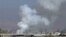 Image taken from video obtained from Shaam News Network, smoke rises from university buildings after shelling, Damascus, March 28, 2013.