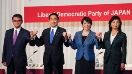Candidates for the presidential election of the ruling Liberal Democratic Party pose prior to a joint news conference at the party's headquarters in Tokyo, Japan, Sept. 17, 2021. The candidates are, from left, Taro Kono, Fumio Kishida, Sanae Takaichi and Seiko Noda.