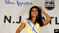 Miss New York Nina Davuluri poses for photographers following her crowning as Miss America 2014, Sunday, Sept. 15, 2013, in Atlantic City, N.J. (AP Photo/Mel Evans)