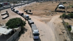 Yardım kamyonları Refah sınır kapısından Gazze'ye girmeye başladı