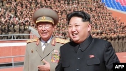 FILE - The man pictured on the left has been identified by South Korea media as Ri Yong-Gil, chief of the Korean People's Army (KPA) General Staff. 