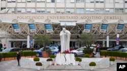 A statue of Pope John Paul II is seen Feb. 17, 2025, in front of the Agostino Gemelli Polyclinic in Rome, where Pope Francis is being treated for a respiratory tract infection.