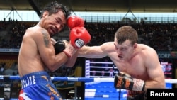 Jeff Horn of Australia punches Manny Pacquiao of the Philippines during the WBO welterweight world title match July 2, 2017 in Brisbane, Australia.