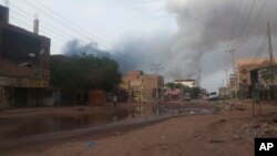 FILE: Smoke rises over Khartoum, Sudan, Wednesday, June 7, 2023. Since then, fighting between the Sudan army and the Rapid Support Forces has continued, though paused briefly by cease-fires that don't hold.
