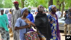 Boko Haram rebels are suspected of abducting dozens of men and boys in Nigeria. Chibok village schoolgirls who escaped the rebels are shown before meeting with Borno state’s governor in Maiduguri June 2, 2014. 