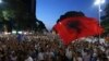 FILE - Anti-government protesters take part in a rally in Tirana, Albania, June 21, 2019. The opposition is boycotting the local elections planned for June 30 and has threatened to disrupt them.