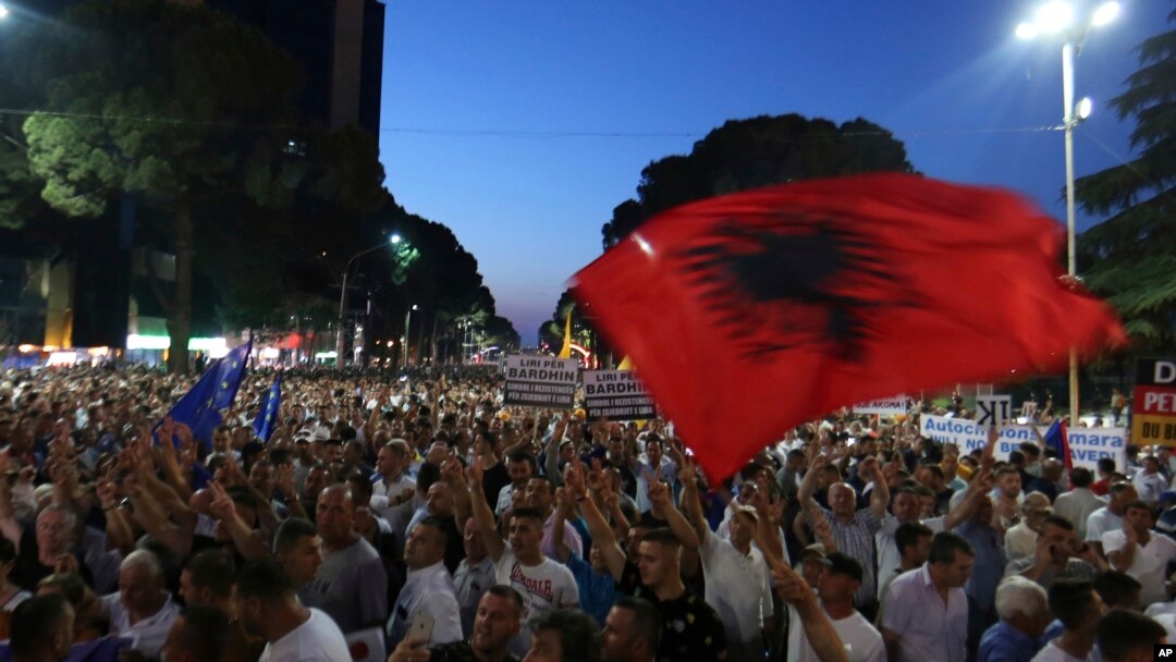FILE - Anti-government protesters take part in a rally in Tirana, Albania, June 21, 2019. The opposition is boycotting the local elections planned for June 30 and has threatened to disrupt them.