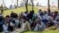 Protesters from Pakistan's Sunni Tehreek group sit in protest near the parliament building in Islamabad, Pakistan, March 30, 2016.