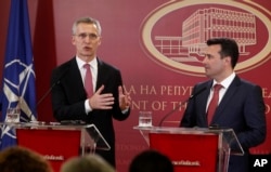 NATO Secretary General Jens Stoltenberg, left, talks for the media during a news conference with Macedonian Prime Minister Zoran Zaev, right, following their meeting at the Government building in Skopje, Macedonia, Jan. 18, 2018.