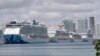 Cruise ships are docked at PortMiami, March 31, 2020, in Miami. 