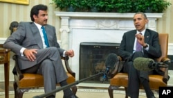 President Barack Obama meets with the Emir of Qatar Sheikh Tamim bin Hamad Al Thani, Feb. 24, 2015, in the Oval Office of the White House.