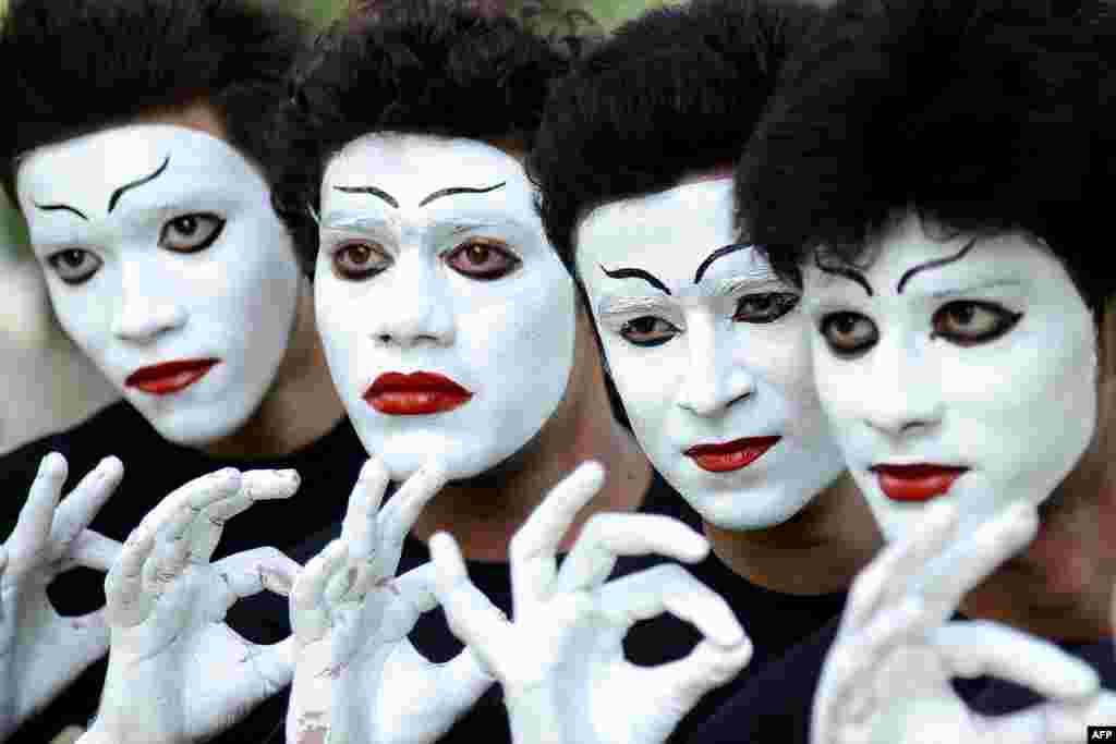 Indian students wait their turn to perform a mime act during a Youth Festival competition at a university in Amritsar. 