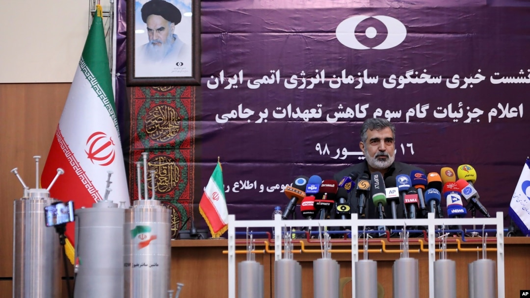 FILE - Atomic Energy Organization of Iran spokesman Behrouz Kamalvandi speaks during a news briefing with advanced centrifuges displayed in front of him, in Tehran, Iran, Sept. 7, 2019.